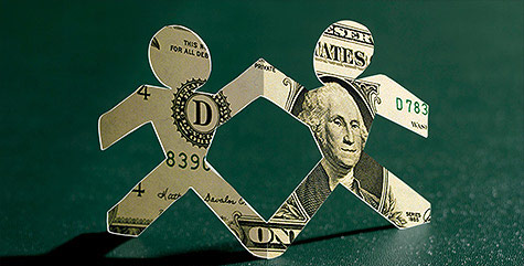People figures cut out of dollar bills