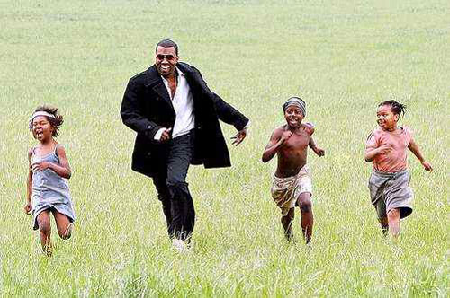 Kanye with African children
