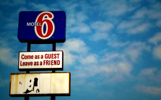 Motel 6 "come as a guest, leave as a friend" sign
