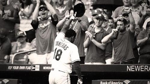 Oscar Taveras tips his hat to fans at the stadium after a homerun