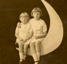 Two racist children sitting on the moon