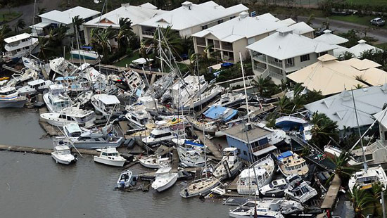 Rich people's yachts all crashed at a dock