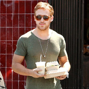 Ryan Gosling holding a bagel