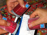 Three American Express credit cards at a dinner table