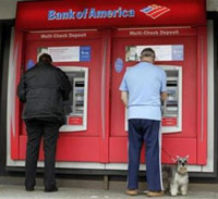 Man and woman withdrawing money from an ATM.