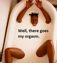 Woman in a bathtub having an orgasm