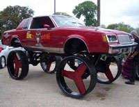 Car sitting on huge rims