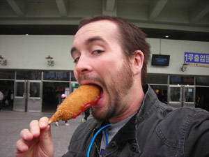 Casey Freeman eating a corndog in the ROK