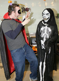 KC dressed a vampire trying to scare a skeleton on Halloween