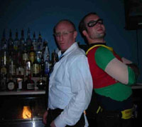 Casey dressed up as Robin with a bartender behind the bar