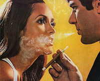 Man blowing cigarette smoke into a woman's face