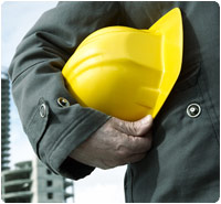 Construction worker holding hard hat