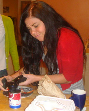 Girl cooking pizza in the kitchen