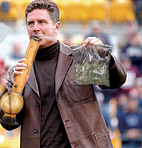 Dan Marino holding a bong and a bag of weed