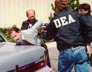 DEA agent arresting a felon