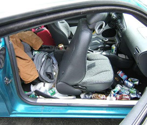 Dirty messy interior of a car - passenger side