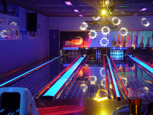 Disco cosmic bowling night with neon lights