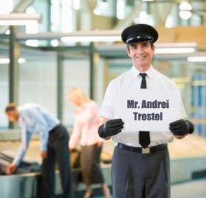 Driver holding a sign at the airport baggage claim