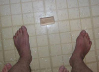 Dropped soap between feet in the prison shower