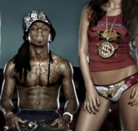 Lil Wayne wearing Ed Hardy with a girl on stage