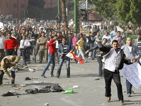 Egyptian riot in the streets during the day