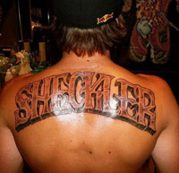Sheckler family name tattoo on a guy's back