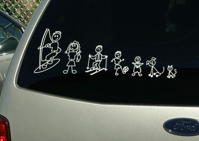 Window stickers of kids in a family on the back of a car.
