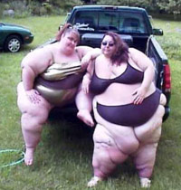 Two obese girls in pickup truck