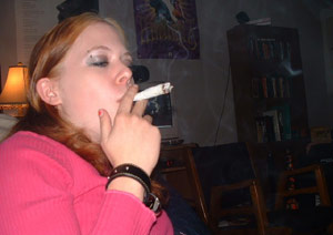Girl smoking weed on the sofa