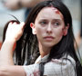 Jennifer Love Hewitt with scratches and blood on her face