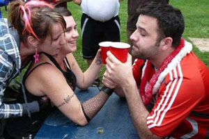 Asshole guy chugs two Solo cup beers outside