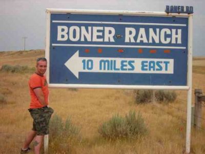 KC next to Boner Ranch sign in South Dakota