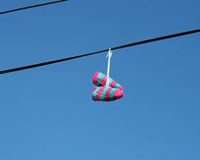 Shoes hanging from a telephone wire