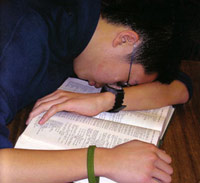Guy asleep in library