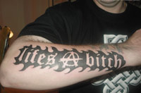 Life's a Bitch tattoo