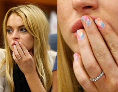 Lindsay Lohan sits in court with 'Fuck u' painted on her fingernail
