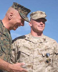 Marine standing next to his Marine dad
