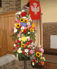 Memorial service flowers in the front of a church