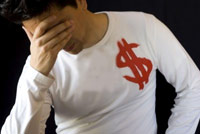Sad man with white shirt with money sign on it