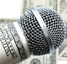 Microphone wrapped in hundred dollar bills