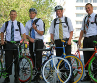 4 Mormons with helmets on fixie bicycles