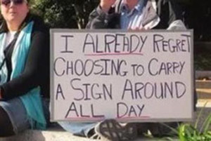 Funny Occupy Wall Street sign: "I Already Regret Carrying Around This Sign All Day"