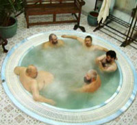 Naked men in locker room hot tub