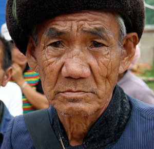 Sad old man with wrinkly face