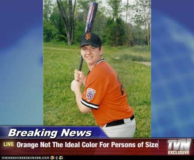 Kid in an orange baseball uniform