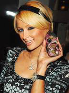 Paris Hilton showing off a phone