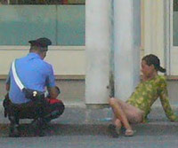 Police officer arresting a prostitute