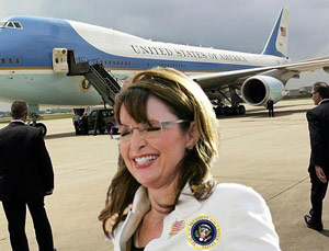 President Sarah Palin stands in front of Air Force One airplane