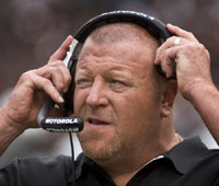 Raiders coach Tom Cable with headset on sideline