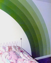 Pink bedroom with green rainbow